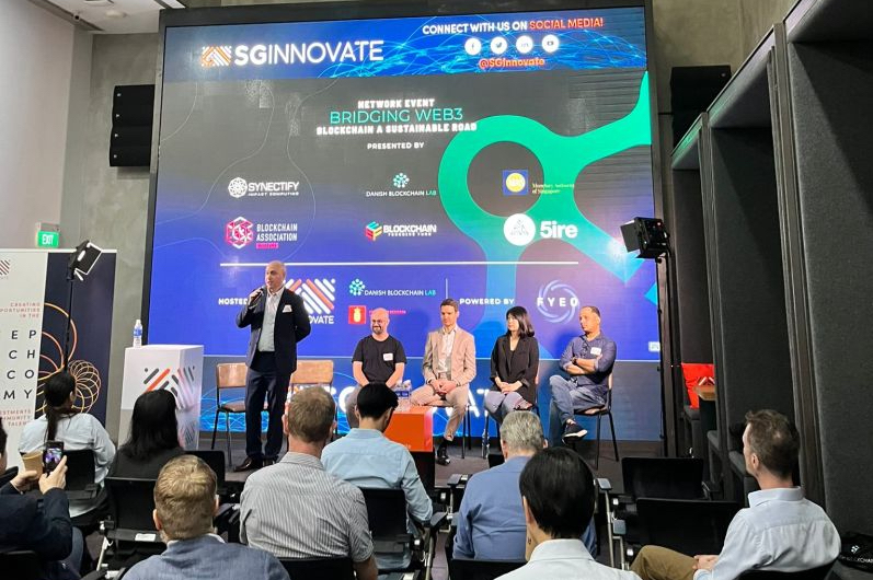 Photo of Dr Peter Finn moderating a panel of web3 experts, Niklas Agerbech speaking